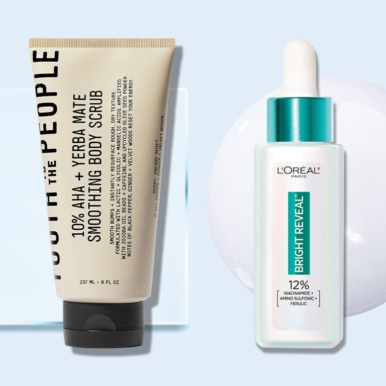 Bottle of Youth to the People 10% AHA + Yerba Mate Smoothing Body Scrub and Bottle of L’Oreal Bright Reveal against a blue background with a cream swatch across it