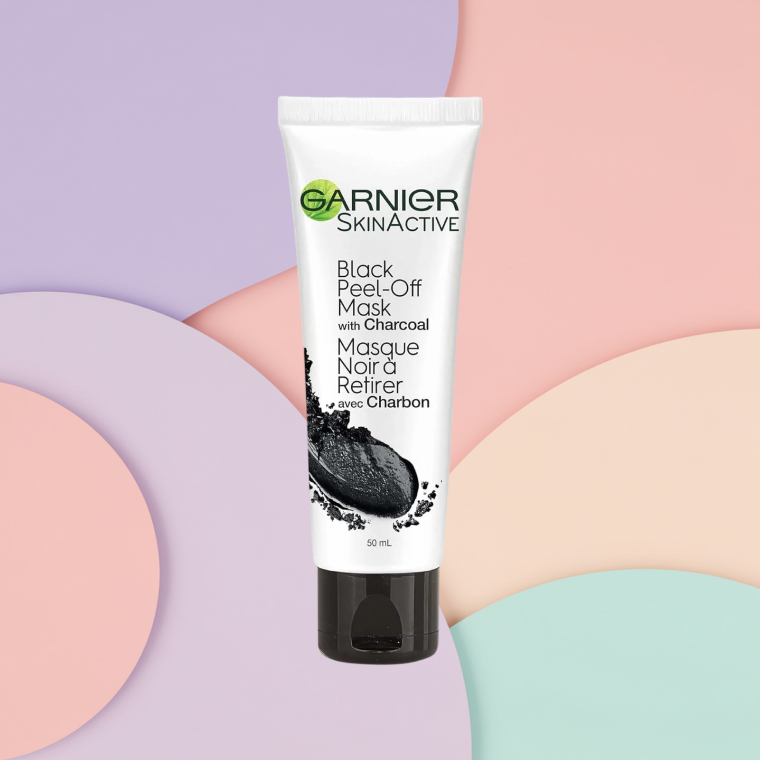 2026_SDC_BestFaceMasks_GarnierSkinActivePeelOffMask Bottle of Garnier SkinActive Peel Off Mask with Charcoal on a textured background